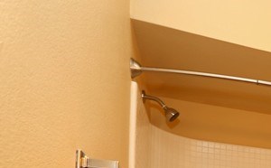Large tan colored bathroom with large vanity and bathtub at Summit Pointe in Oklahoma City, OK